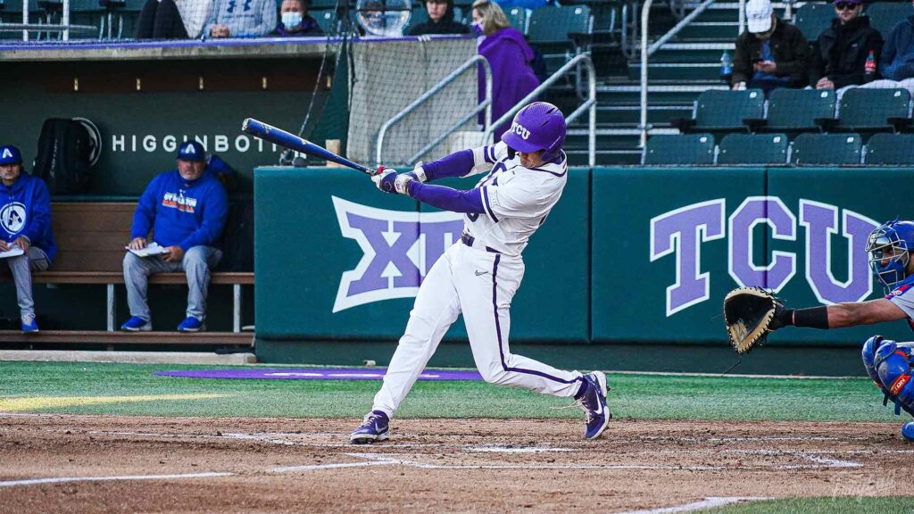 Tcu baseball player in the middle of a swing during a game in Fort Worth 